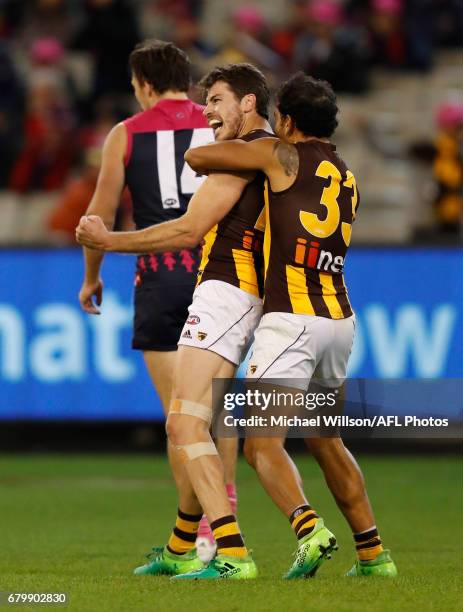 Cyril Rioli and Isaac Smith of the Hawks celebrate during the 2017 AFL round 07 match between the Melbourne Demons and the Hawthorn Hawks at the...