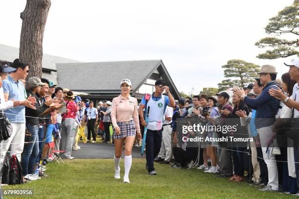 Shin-Ae Ahn of South Korea walks up to the 1st tee during the final round of the World Ladies Championship Salonpas Cup at the Ibaraki Golf Club on...