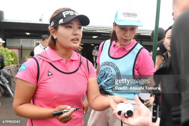 Ai Suzuki of Japan signs autographs for fans during the final round of the World Ladies Championship Salonpas Cup at the Ibaraki Golf Club on May 7,...