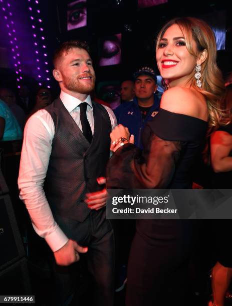 Boxer Canelo Alvarez and Fernanda Gomez celebrate during his after-fight party at Jewel Nightclub at the Aria Resort & Casino on May 6, 2017 in Las...