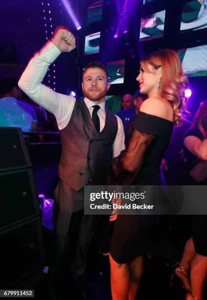 Boxer Canelo Alvarez and Fernanda Gomez celebrate during his after-fight party at Jewel Nightclub at the Aria Resort & Casino on May 6, 2017 in Las...