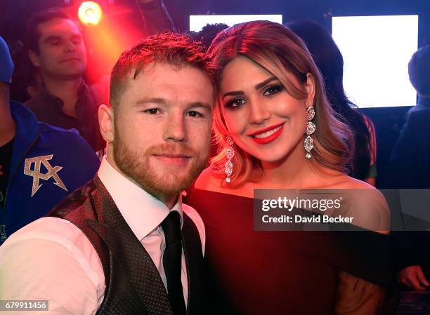 Boxer Canelo Alvarez and Fernanda Gomez celebrate during his after-fight party at Jewel Nightclub at the Aria Resort & Casino on May 6, 2017 in Las...