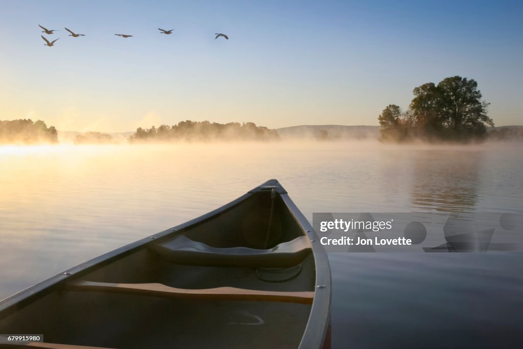 Canoe on Lake at Sunrise