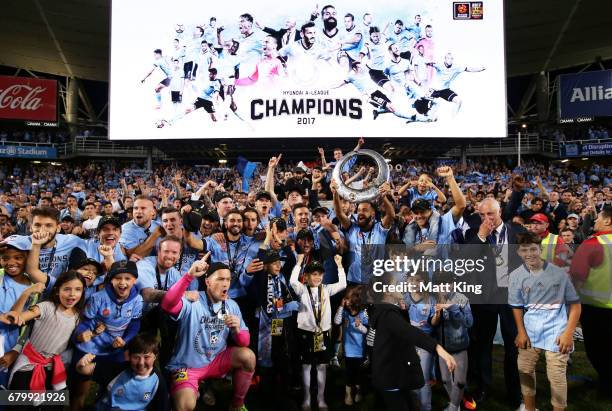 Alex Brosque captain of Sydney FC holds aloft the A-League trophy in front of The Cove after the 2017 A-League Grand Final match between Sydney FC...