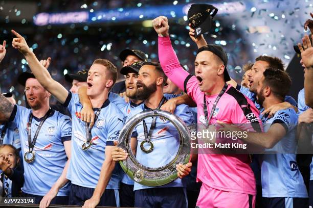 Alex Brosque captain of Sydney FC holds aloft the A-League trophy and celebrates with team mates during the 2017 A-League Grand Final match between...