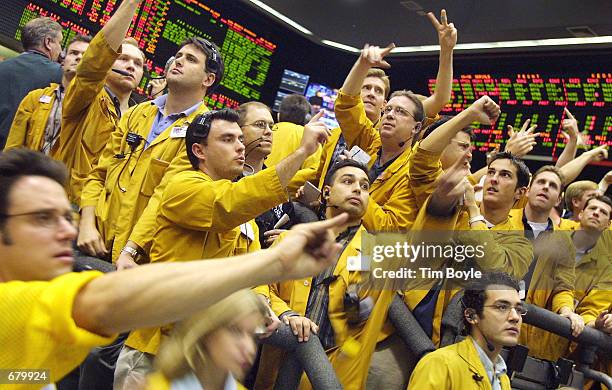 Traders and clerks work on the Eurodollar Futures floor of the Chicago Mercantile Exchange November 6, 2001 after the FOMC announced an interest rate...