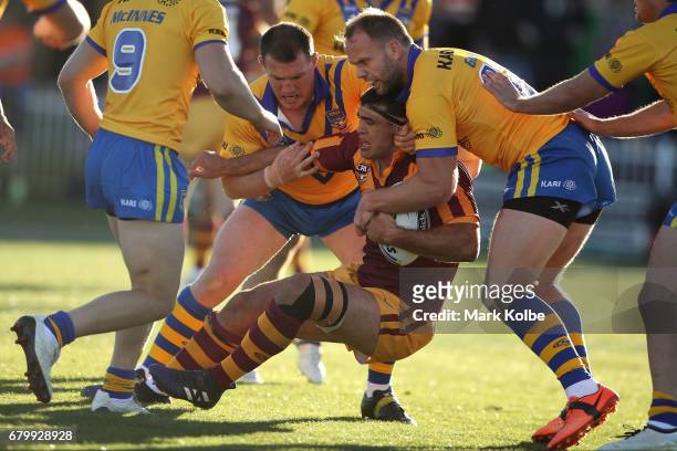 Dale Finucane of Country is tackled by Paul Gallen and David Gower of City during the 2017 City versus Country Origin match at Glen Willow Sports...