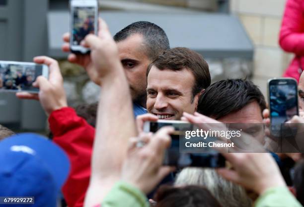 French presidential election candidate for the 'En Marche!' political movement, Emmanuel Macron leaves her home before his vote at the polling...