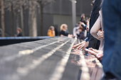 National September 11 Memorial in Manhattan, People touch the names of loved ones