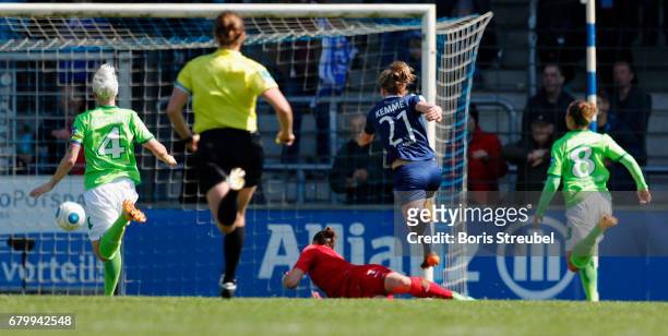 Tabea Kemme of Turbine Potsdam scores her team's first goal against goalkeeper Almuth Schult of VfL Wolfsburg during the Allianz Women's Bundesliga...