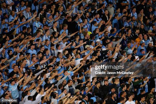 Sydney supporters in The Cove cheer during the 2017 A-League Grand Final match between Sydney FC and the Melbourne Victory at Allianz Stadium on May...
