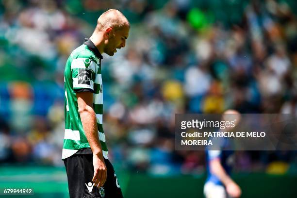 Sporting's Dutch forward Bas Dost looks downwards after missing a goal opportunity during the Portuguese league football match Sporting CP vs OS...