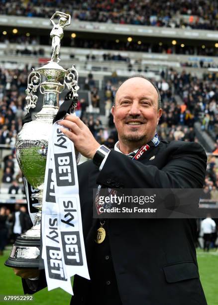 Rafael Benitez, Manager of Newcastle United celebrates with the Championship trophy after the Sky Bet Championship match between Newcastle United and...