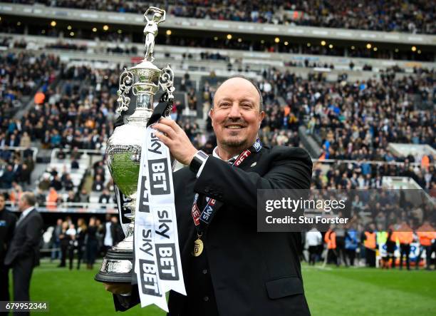 Rafael Benitez, Manager of Newcastle United celebrates with the Championship trophy after the Sky Bet Championship match between Newcastle United and...