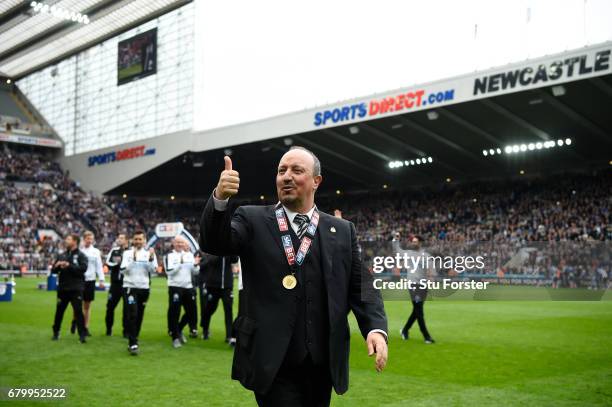 Rafael Benitez, Manager of Newcastle United celebrates with his winners medal after the Sky Bet Championship match between Newcastle United and...