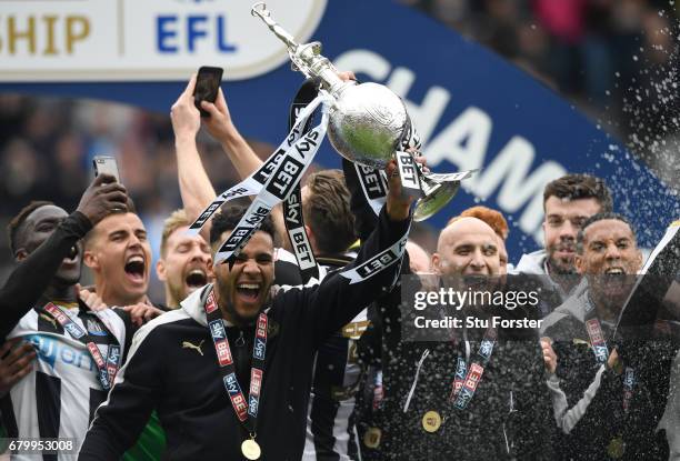 Jamaal Lascelles of Newcastle United and Jonjo Shelvey of Newcastle United celebrate with the Championship Trophy after the Sky Bet Championship...