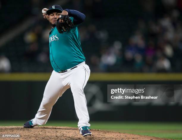 Reliever Jean Machi of the Seattle Mariners delivers a pitch during a game against the Texas Rangers at Safeco Field on May 5, 2017 in Seattle,...