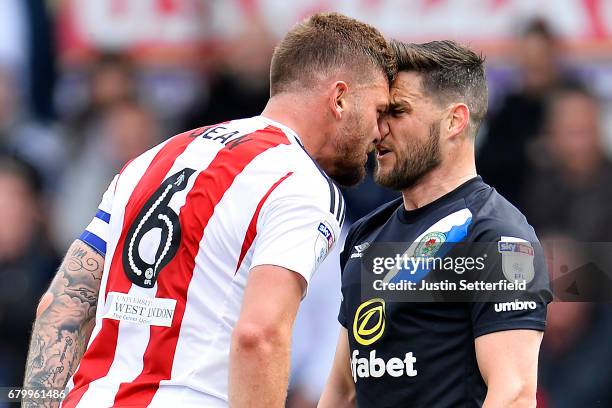 Harlee Dean of Brentford and Craig Conway of Blackburn Rovers confront each other during the Sky Bet Championship match between Brentford and...