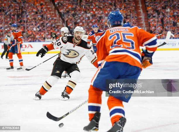 Darnell Nurse of the Edmonton Oilers is watched by Antoine Vermette of the Anaheim Ducks in Game Four of the Western Conference Second Round during...