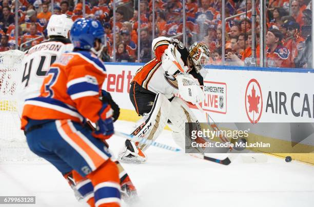 David Desharnais of the Edmonton Oilers skates in after Nate Thompson of the Anaheim Ducks as Ducks' goalie John Gibson clears the puck in Game Four...