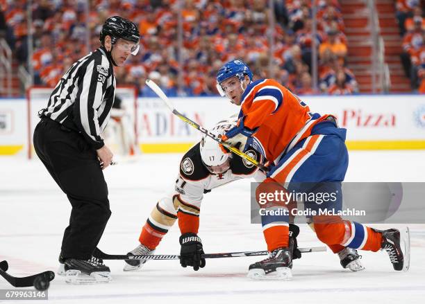 Connor McDavid of the Edmonton Oilers faces off against Ryan Kesler of the Anaheim Ducks in Game Four of the Western Conference Second Round during...