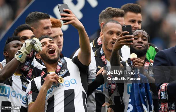 Newcastle United players Vurnon Anita and Achraf Lazaar celebrate by taking selfie photographs after winning the Sky Bet Championship match between...