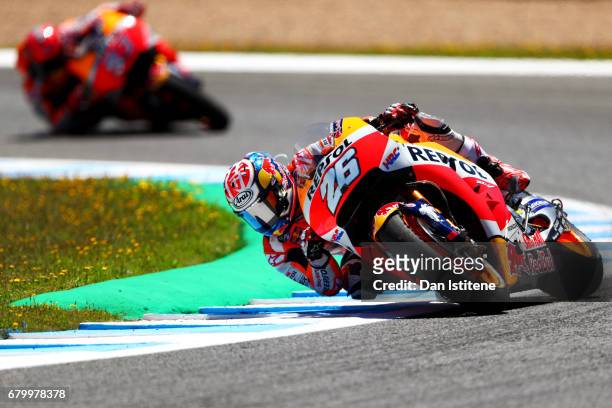 Dani Pedrosa of Spain and the Repsol Honda Team rides ahead of Marc Marquez of Spain and the Repsol Honda Team during the MotoGP of Spain at Circuito...