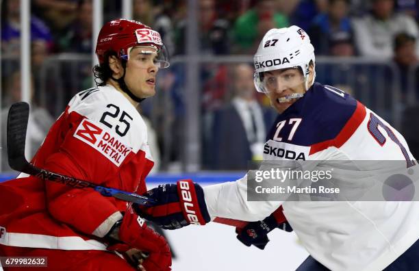 Anders Lee of USA battles for position with Oliver Lauridsen of Denmark during the 2017 IIHF Ice Hockey World Championship game between USA and...