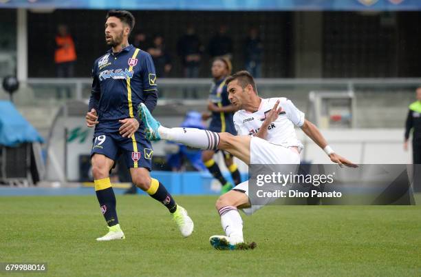 Fabrizio Cacciatore of AC ChievoVerona competes with Ivaylo Chocev of US Citta di Palermo during the Serie A match between AC ChievoVerona and US...