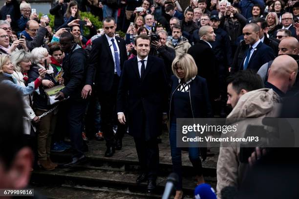 Founder and Leader of the political movement 'En Marche !' and presidential candidate Emmanuel Macron and his wife Brigitte Trogneux go to vote for...