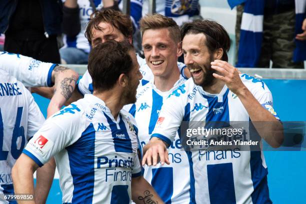 Mattias Bjarsmyr of IFK Goteborg celebrates with teammates after scoring during the Allsvenskan match between IFK Goteborg and Kalmar FF at Gamla...