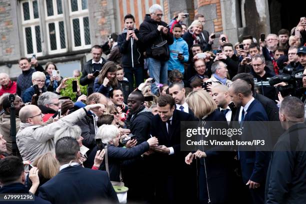 Founder and Leader of the political movement 'En Marche !' and presidential candidate Emmanuel Macron and his wife Brigitte Trogneux go to vote for...