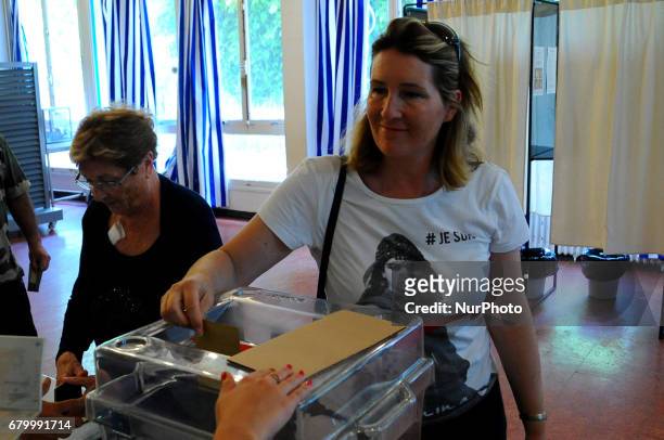 French people cast their vote during the second round of the French presidential election, on May 7, 2017 in La Marsa near Tunis, Tunisia.