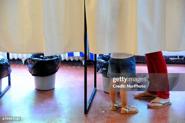 French people cast their vote during the second round of the French presidential election, on May 7, 2017 in La Marsa near Tunis, Tunisia.