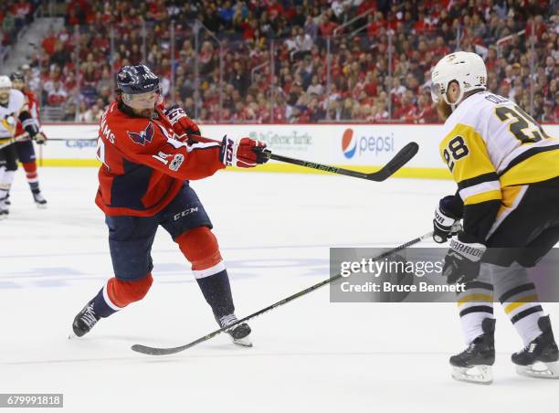 Justin Williams of the Washington Capitals takes a slapshot against the Pittsburgh Penguins in Game Five of the Eastern Conference Second Round...