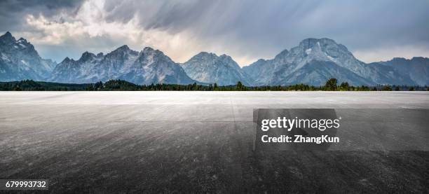 automotive background - snowy mountain road stock pictures, royalty-free photos & images