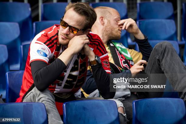 Feyenoord fans react after the Dutch Eredivisie football match between Excelsior and Feyenoord in Rotterdam on May 7, 2017. Feyenoord will have to...