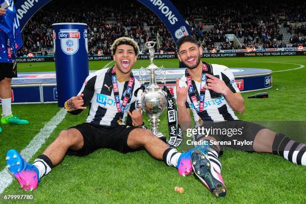 Newcastle's DeAndre Yedlin and Achraf Lazaar celebrate with the trophy after winning the championship league during the Sky Bet Championship Match...