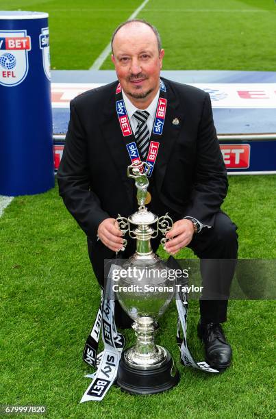 Newcastle United Manager Rafael Benitez poses with the trophy after winning the championship league during the Sky Bet Championship Match between...