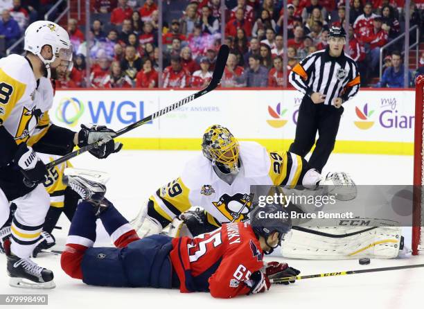 Marc-Andre Fleury of the Pittsburgh Penguins makes the save on Andre Burakovsky of the Washington Capitals in Game Five of the Eastern Conference...