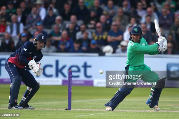 Gary Wilson of Ireland hits out as Sam Billings England wicket keeper looks on during the Royal London ODI between England and Ireland at Lord's...