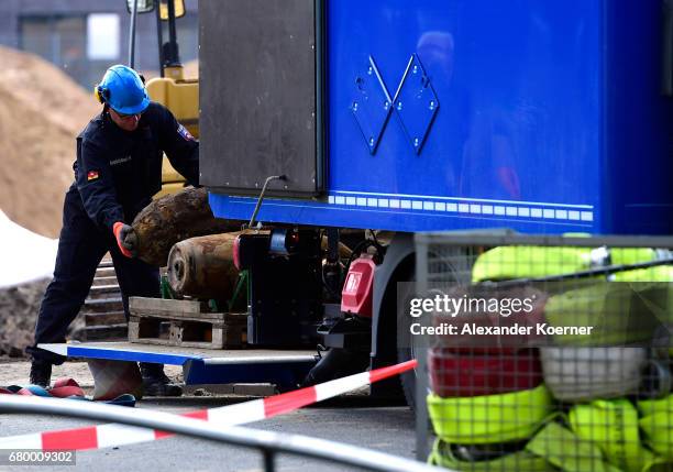 An officer of the Explosive Ordnance Disposal Division load a five centner bomb on to a truck after it was made safe on May 7, 2017 in Hanover,...