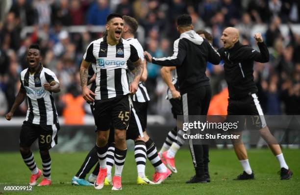 Aleksander Mitrovic and team mates of Newcastle celebrate after hearing the score from the Brighton game means that they win the the Sky Bet...