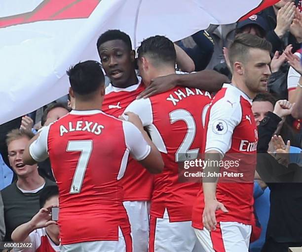 Danny Welbeck of Arsenal celebrates scoring their second goal during the Premier League match between Manchester United and Arsenal at Emirates...