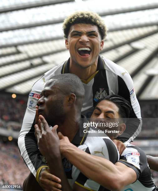 Chancel Mbemba of Newcastle celebrates after scoring the second goal with Deandre Yedlin and Ayoze Perez during the Sky Bet Championship match...