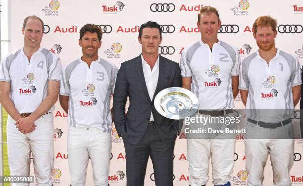 Prince William, Duke of Cambridge, Nic Roldan, actor Luke Evans, Tom Morley and Prince Harry attend the Audi Polo Challenge at Coworth Park on May 7,...