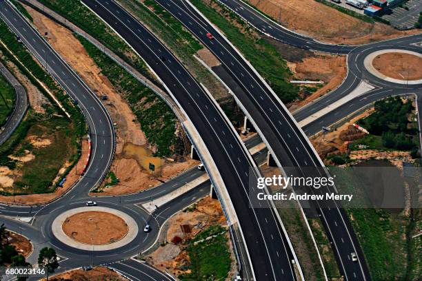 roundabouts and freeway, prestons, western sydney, aerial photography - westby stock pictures, royalty-free photos & images