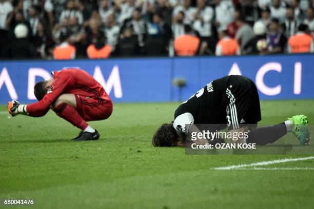 Besiktas' goalkeeper Fabricio Agosto Ramirez and defender Atinc Nukan react after Fenerbahce scored a goal during the Turkish Spor Toto Super Lig...