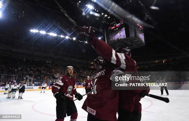 Latvia´s players celebrate scoring during IIHF Icehockey world championship first round match between Latvia and Slovakia in the LANXESS arena in...
