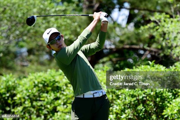 Seung-Yul Noh plays his shot from the fourth tee during the final round of the Wells Fargo Championship at Eagle Point Golf Club on May 7, 2017 in...